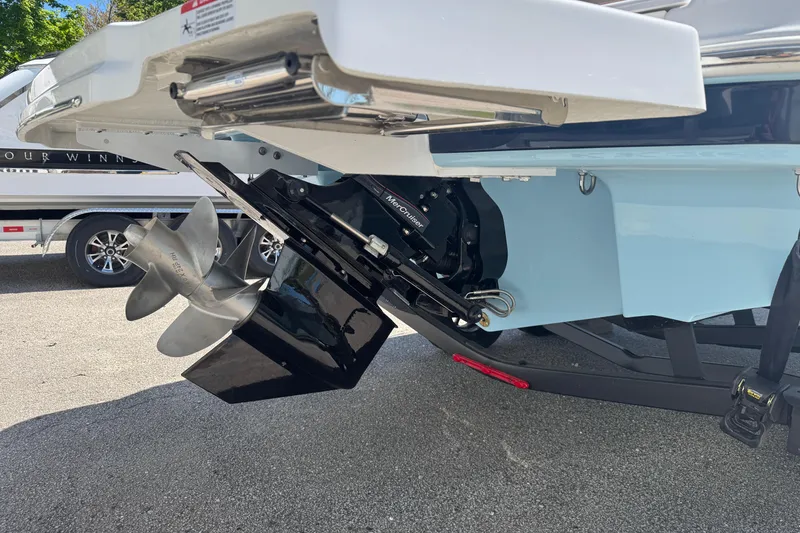 Slide: The Image of 2025 Four Winns HD3 boat with a detailed view of the propeller and stern drive. - 4