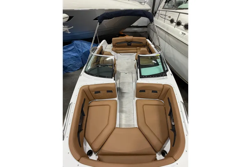 Slide: The Image of 2025 Four Winns HD3 boat interior with tan seating and sleek design. - 7