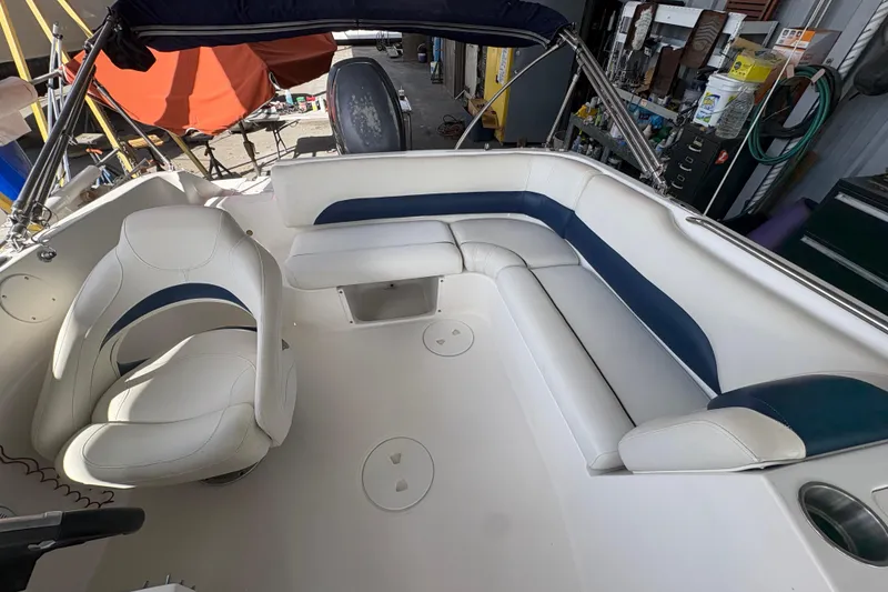 Slide: The Image of 2014 Hurricane SunDeck 187 OB boat interior with steering wheel and seating. - 3