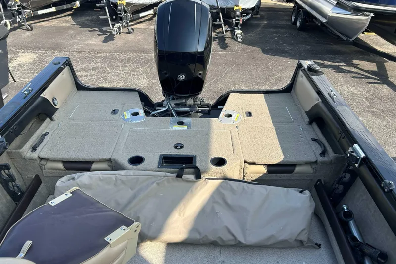 Slide: The Image of 2017 Crestliner 1850 Super Hawk boat interior with motor and seating area. - 10