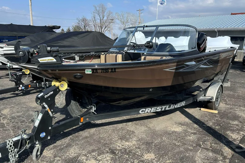 Slide: The Image of 2017 Crestliner 1850 Super Hawk boat on trailer, parked outdoors. - 3
