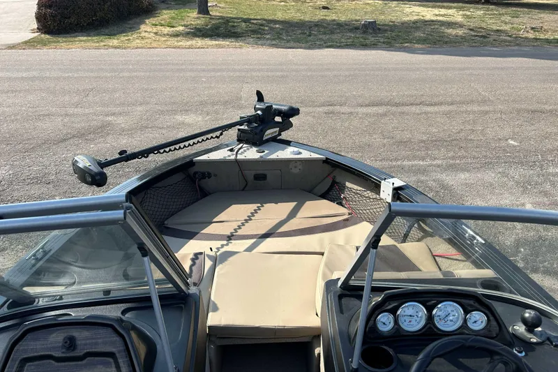 Slide: The Image of 2017 Crestliner 1850 Super Hawk boat interior with dashboard and seating area. - 6