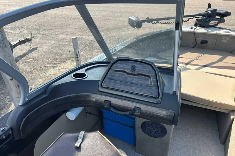 Slide: The Image of 2017 Crestliner 1850 Super Hawk boat interior with steering console and seating area. - 8