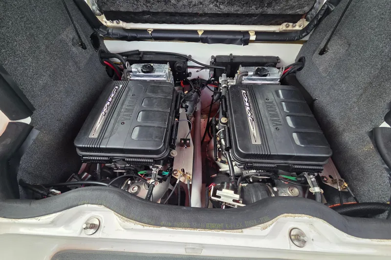 Slide: The Image of Twin engines of a 2005 Yamaha Boats AR230, showcasing detailed mechanical components. - 11