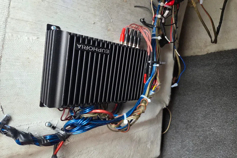 Slide: The Image of Audio amplifier installation in 2005 Yamaha AR230 boat with visible wiring connections. - 18