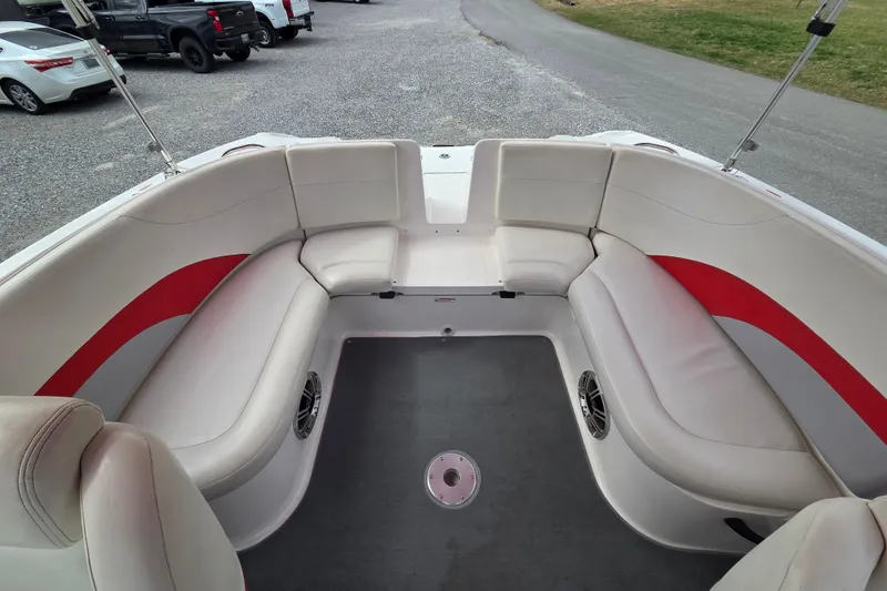 Slide: The Image of 2005 Yamaha Boats AR230 interior with white and red seating, spacious layout. - 5