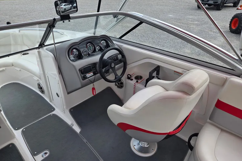 Slide: The Image of 2005 Yamaha Boats AR230 interior with steering wheel, gauges, and seating. - 6