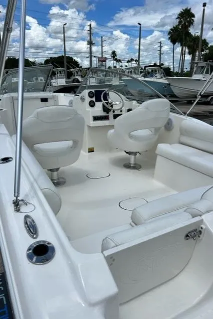 Slide: The Image of Interior of a 2024 Key West 203 DFS boat with white seating. - 11