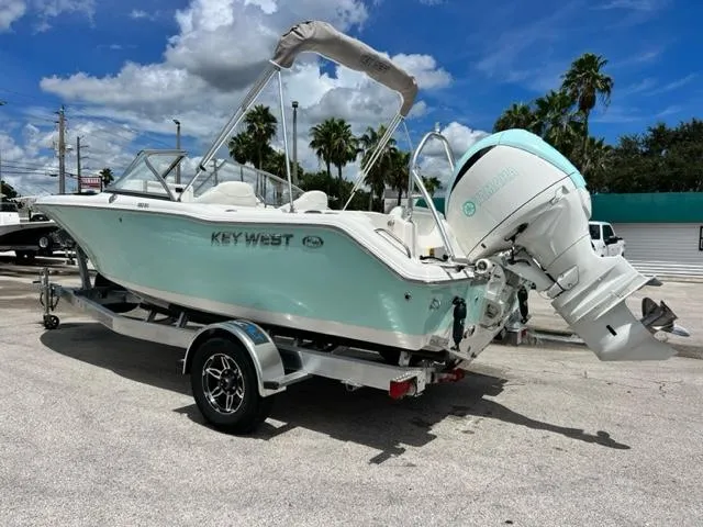Slide: The Image of 2024 Key West 203 DFS boat on trailer, blue sky. - 3