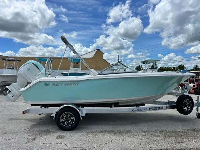 Slide: The Image of 2024 Key West 203 DFS boat on trailer, blue sky. - 5