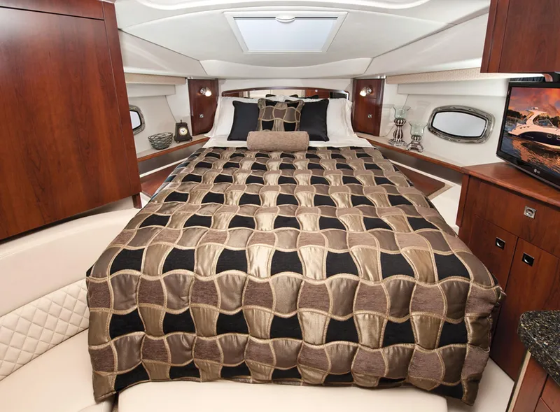 Slide: The Image of Manufacturer Provided Image: Luxurious bedroom interior of 2013 Chaparral 310 Signature yacht with elegant bedding. - 10