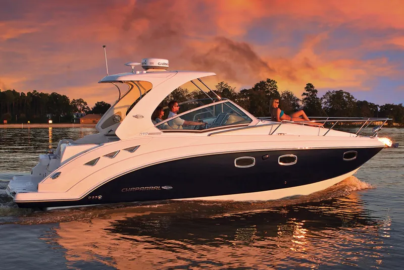 Slide: The Image of Manufacturer Provided Image: 2013 Chaparral 310 Signature boat cruising at sunset on a calm lake. - 2