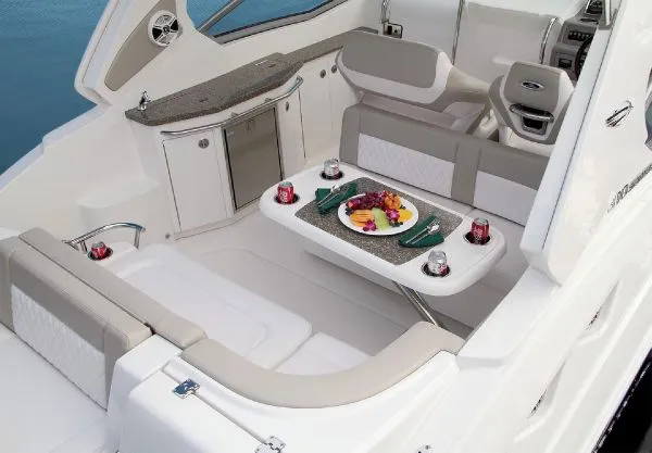 Slide: The Image of Manufacturer Provided Image: 2013 Chaparral 310 Signature boat interior with dining table and seating area. - 7