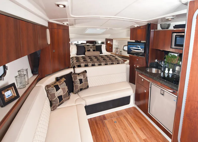 Slide: The Image of Manufacturer Provided Image: 2013 Chaparral 310 Signature yacht interior with modern kitchen and cozy seating area. - 8