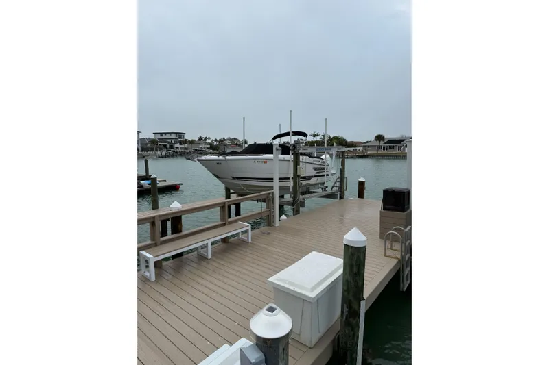 The Image of 2020 Monterey 255SS Super Sport boat docked at a marina with overcast sky. - 0