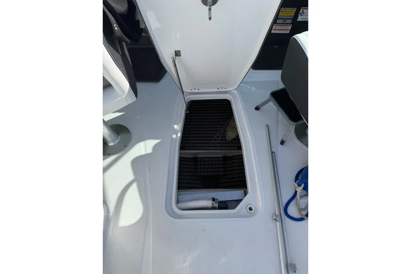 Slide: The Image of Open storage compartment on 2020 Monterey 255SS Super Sport boat deck. - 10
