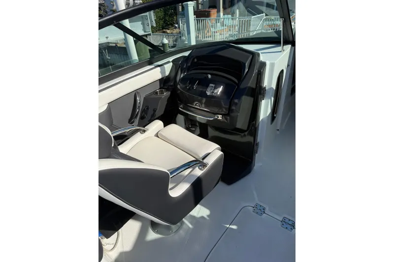 Slide: The Image of 2020 Monterey 255SS Super Sport boat interior with sleek helm and comfortable seating. - 11