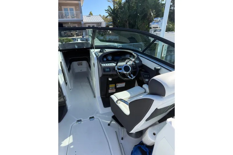 Slide: The Image of 2020 Monterey 255SS Super Sport boat interior with steering wheel and seating. - 6
