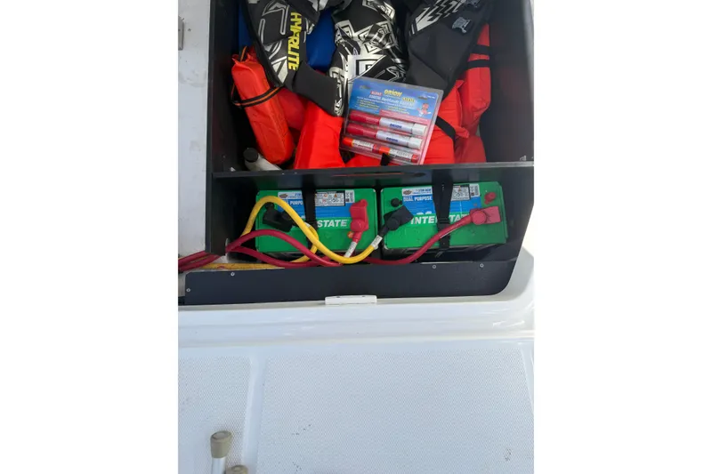 Slide: The Image of Storage compartment of 2020 Monterey 255SS Super Sport with batteries and safety gear. - 9