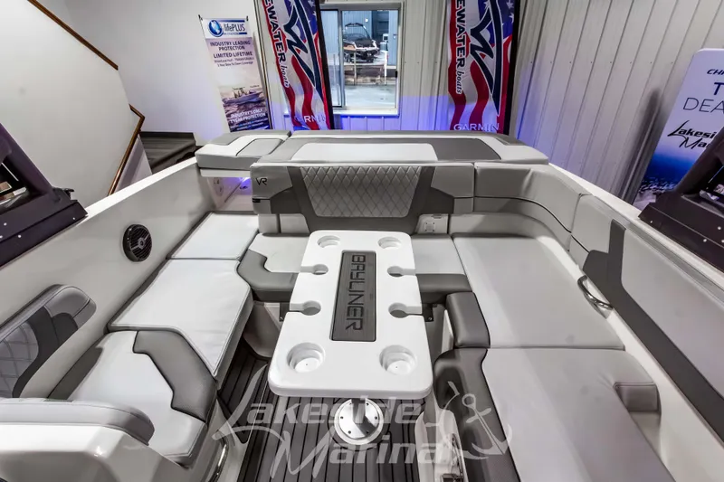 Slide: The Image of 2023 Bayliner VR6 Bowrider I/O interior with seating and table, displayed at Lakeside Marina. - 14