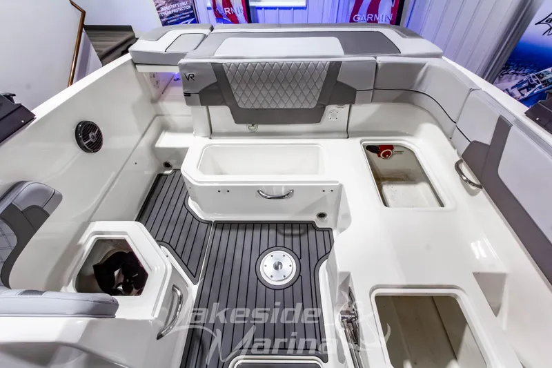 Slide: The Image of 2023 Bayliner VR6 Bowrider I/O interior with seating and storage compartments. - 15