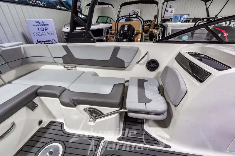Slide: The Image of 2023 Bayliner VR6 Bowrider I/O interior with gray seating and modern design. - 28