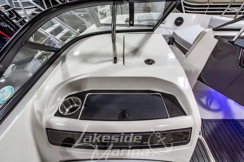 Slide: The Image of 2023 Bayliner VR6 Bowrider I/O interior with sleek dashboard and cup holder. - 29