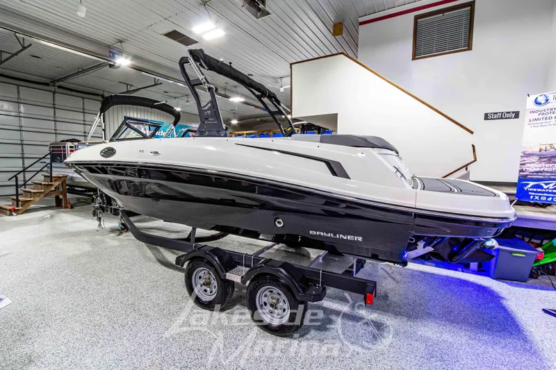 Slide: The Image of 2023 Bayliner VR6 Bowrider I/O on trailer in indoor showroom. - 3