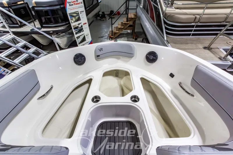 Slide: The Image of 2023 Bayliner VR6 Bowrider I/O boat interior with seating and storage compartments. - 33