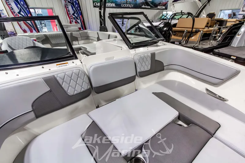 Slide: The Image of 2023 Bayliner VR6 Bowrider I/O interior with gray seating and modern design. - 35
