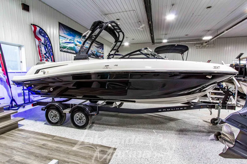 Slide: The Image of 2023 Bayliner VR6 Bowrider I/O displayed indoors on a trailer. - 7