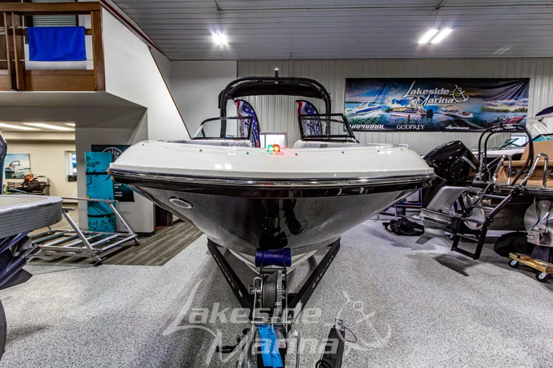 Slide: The Image of 2023 Bayliner VR6 Bowrider I/O displayed indoors at Lakeside Marina showroom. - 8