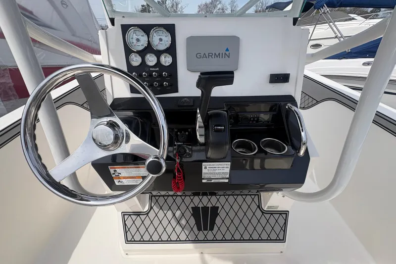 Slide: The Image of Helm console of a 2019 Wellcraft 202 Fisherman boat. - 13