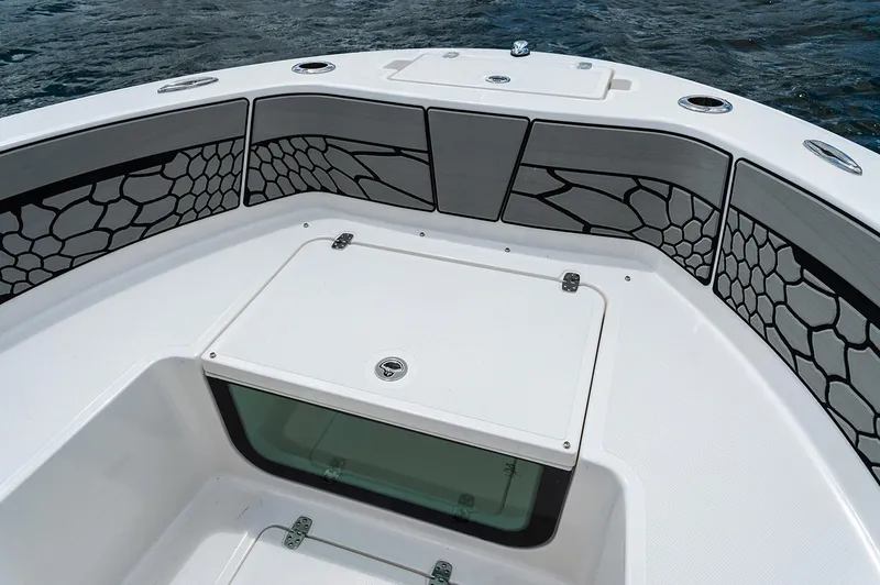 Slide: The Image of Manufacturer Provided Image: 2019 Wellcraft 202 Fisherman boat bow with storage compartment and cushioned seating. - 4