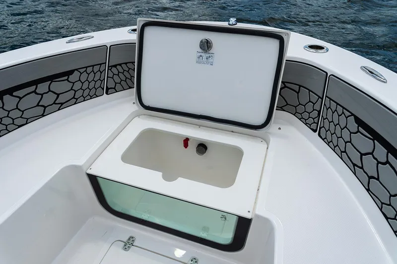 Slide: The Image of Manufacturer Provided Image: 2019 Wellcraft 202 Fisherman boat storage compartment with open lid. - 5