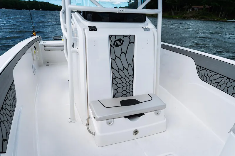 Slide: The Image of Manufacturer Provided Image: 2019 Wellcraft 202 Fisherman boat interior with seating and storage. - 6