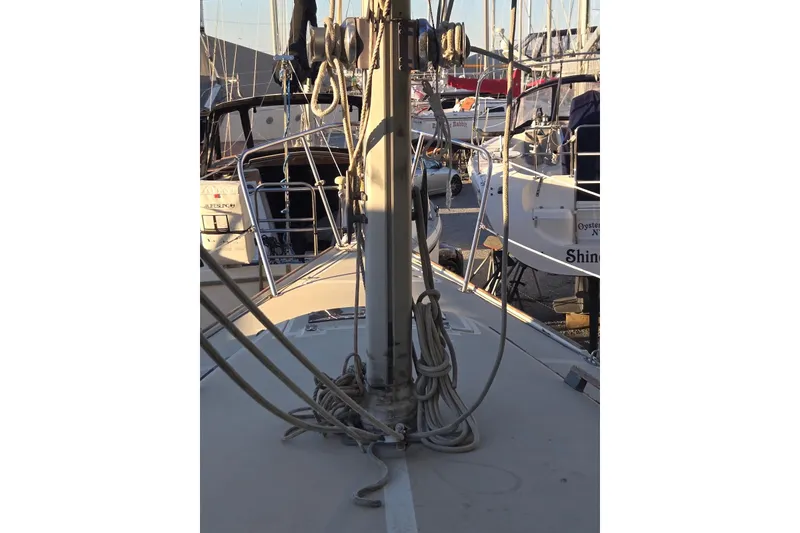 Slide: The Image of 1982 O'Day 28 sailboat deck with rigging and marina background. - 2