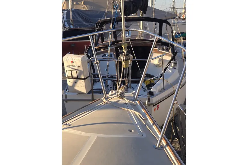 Slide: The Image of 1982 O'Day 28 sailboat deck with Lifesling, docked in marina. - 3