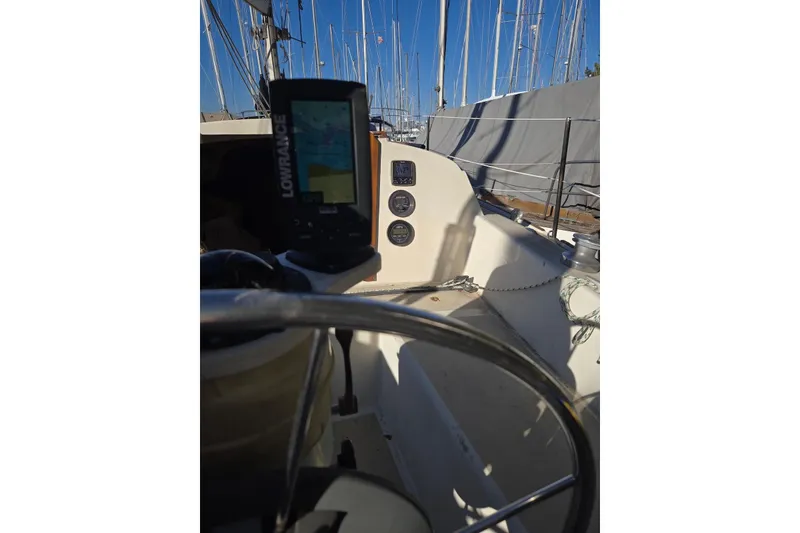 Slide: The Image of 1982 O'Day 28 sailboat cockpit with navigation equipment and steering wheel. - 9