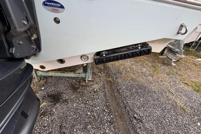 Slide: The Image of 2024 Sportsman Heritage 231 Center Console boat with Yamaha engine and Seakeeper stabilizer. - 2