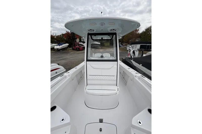 Slide: The Image of 2024 Sportsman Heritage 231 Center Console boat with sleek design and spacious seating. - 5