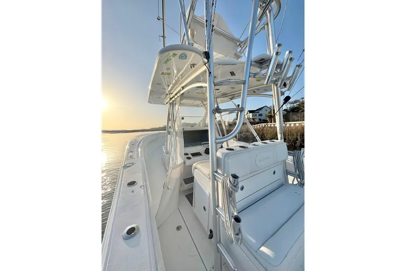 Slide: The Image of 2017 SeaHunter 35 Tournament boat, sleek design, sunrise on calm water. - 14