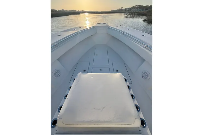 Slide: The Image of 2017 SeaHunter 35 Tournament boat deck at sunrise on calm water. - 15