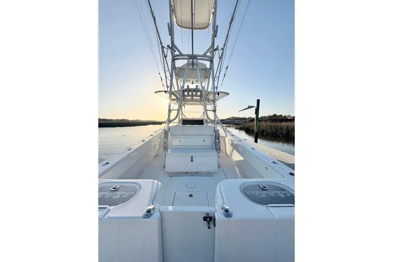 Slide: The Image of 2017 SeaHunter 35 Tournament boat on calm water at sunset. - 17