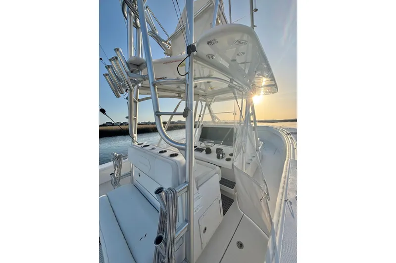 Slide: The Image of 2017 SeaHunter 35 Tournament boat interior with sunset view, featuring helm and seating. - 18