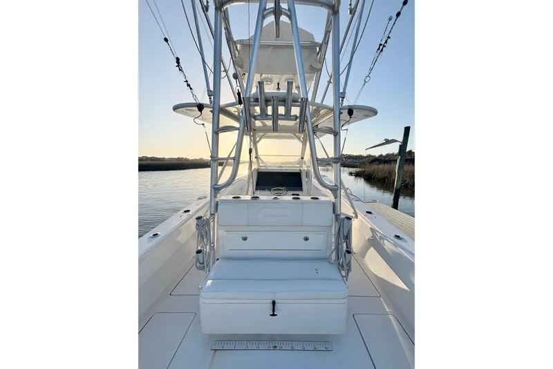 Slide: The Image of 2017 SeaHunter 35 Tournament boat with tower, docked at sunset. - 19
