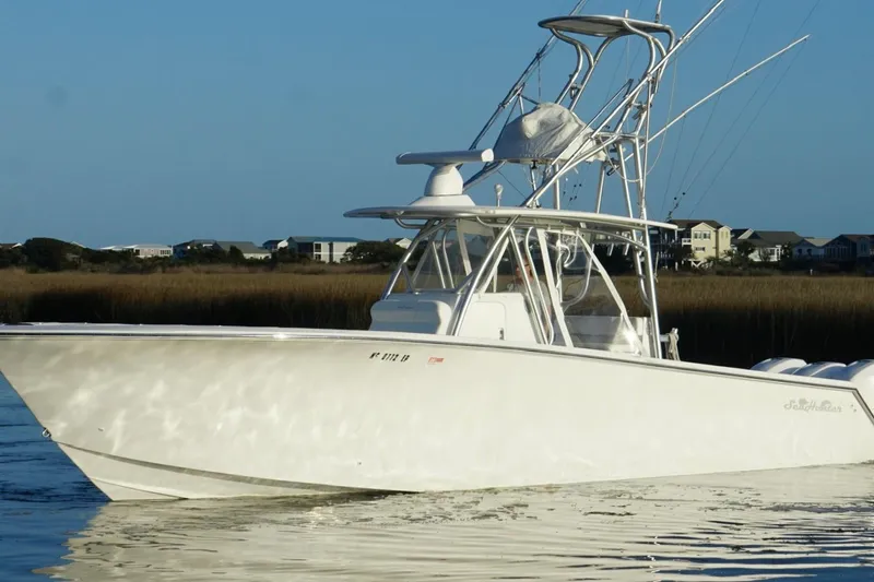 Slide: The Image of 2017 SeaHunter 35 Tournament boat on calm water, clear sky background. - 4