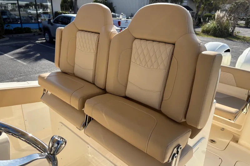 Slide: The Image of Luxurious beige seating on 2023 Scout 277 LXF boat, featuring elegant stitching and design. - 17