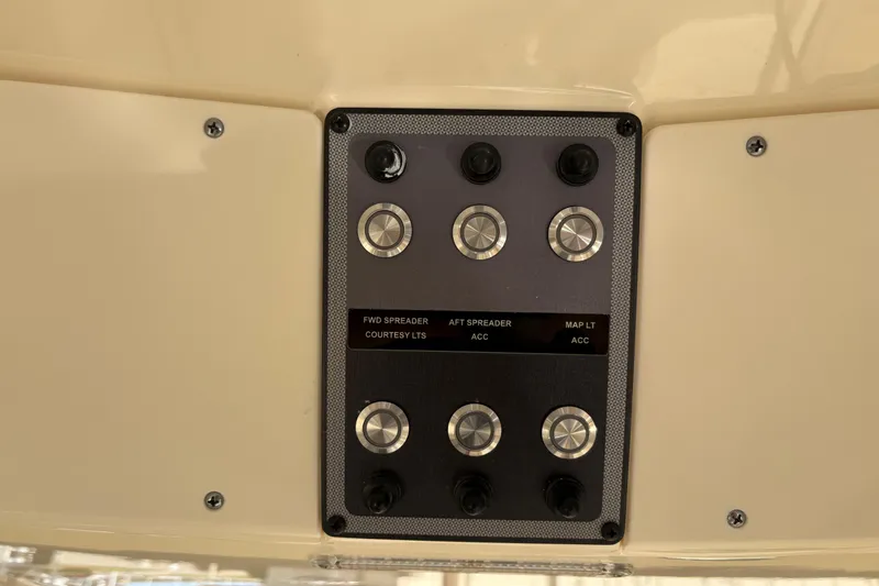 Slide: The Image of Control panel on 2023 Scout 277 LXF boat with labeled switches and buttons. - 20