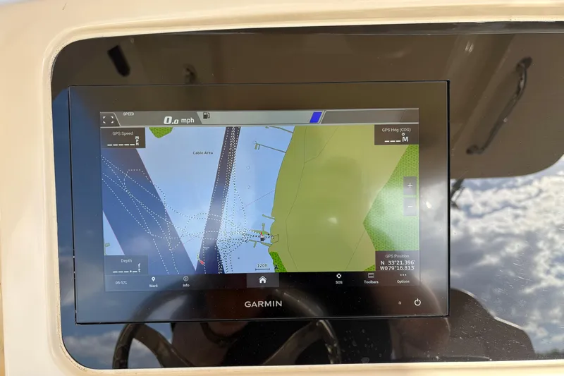 Slide: The Image of Garmin navigation display on 2023 Scout 277 LXF boat, showing map and speed data. - 26